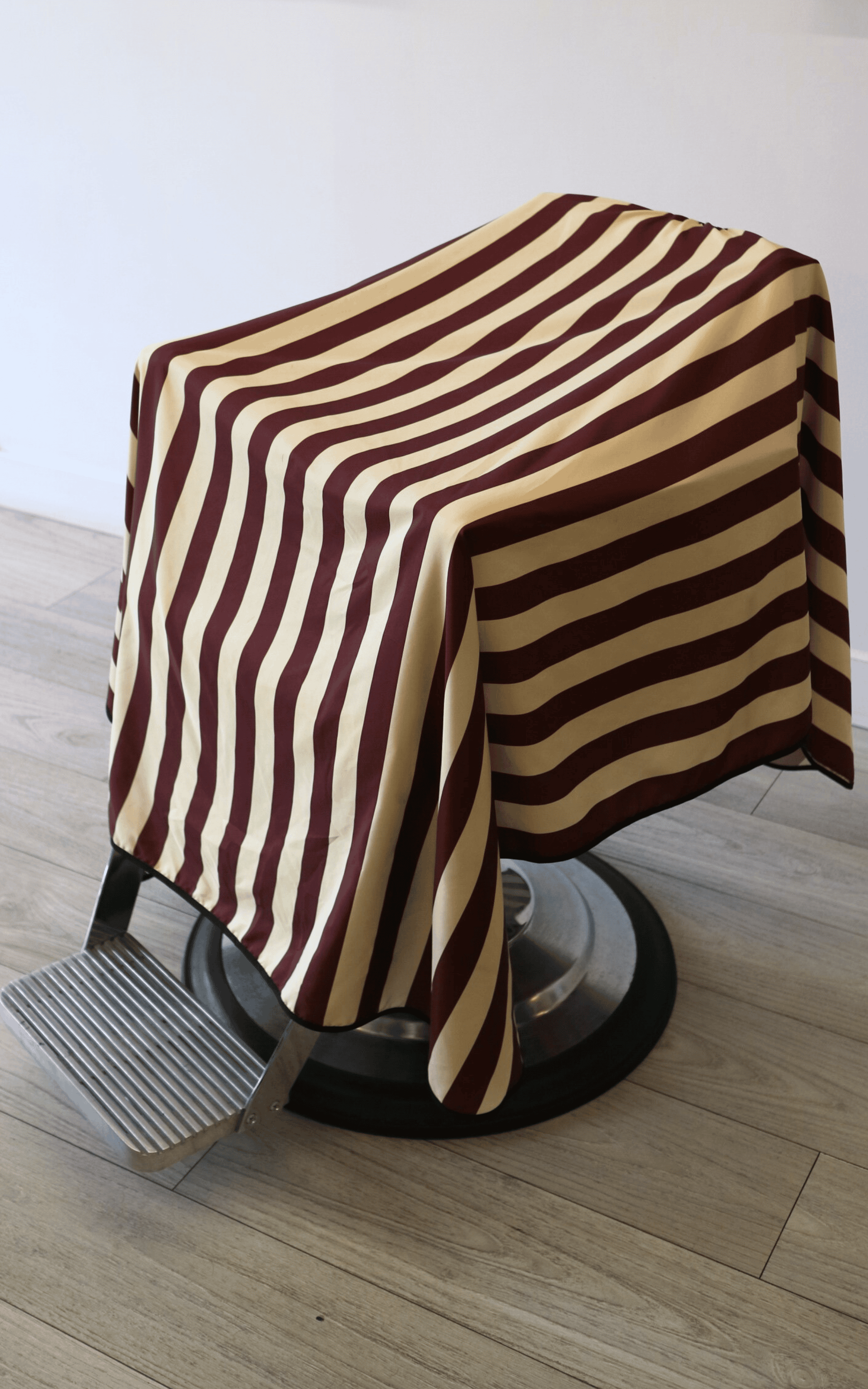 Burgundy and cream striped cutting cape for barbershops and salons