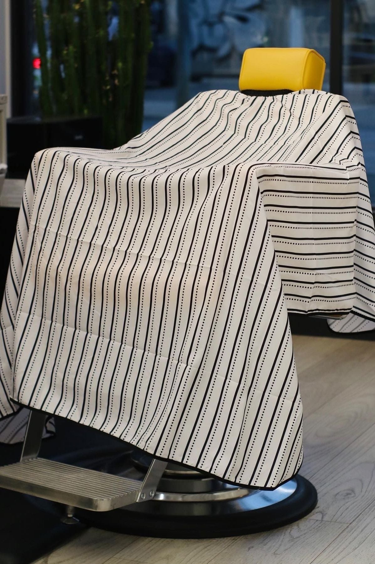 extra large pinstripe barber cape on chair