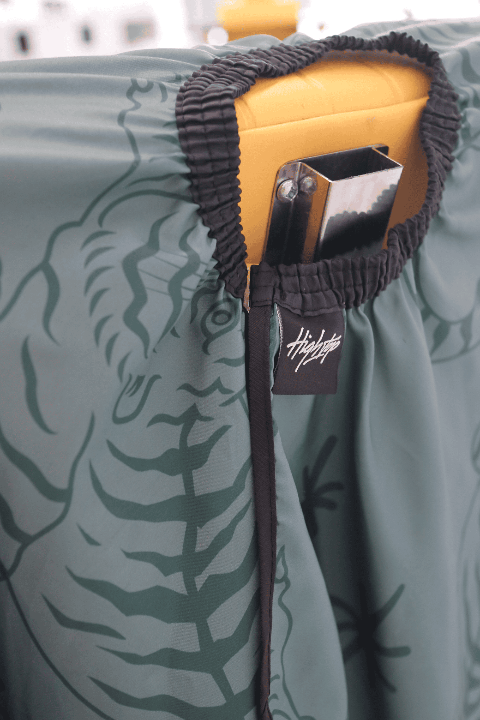 close up of elastic neck on green tora cutting cape